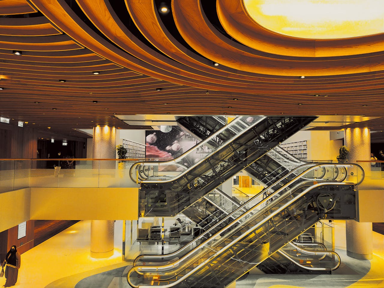 our-story Modern shopping mall with stunning architecture and escalators under a unique ceiling.